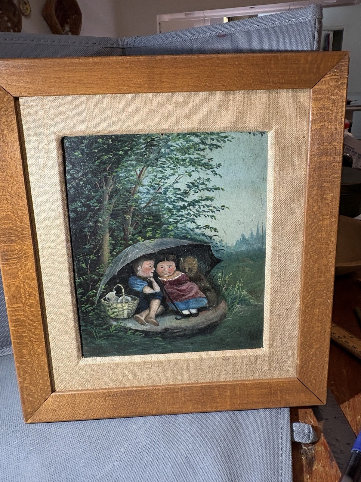 1800s painting of children under an umbrella