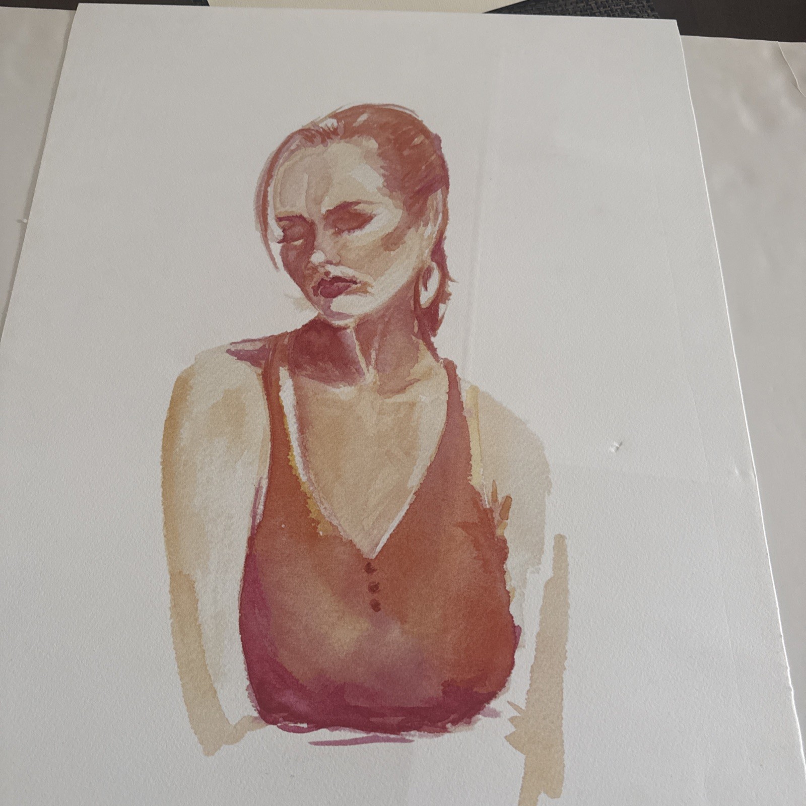 Watercolor portrait of a girl in an orange dress.