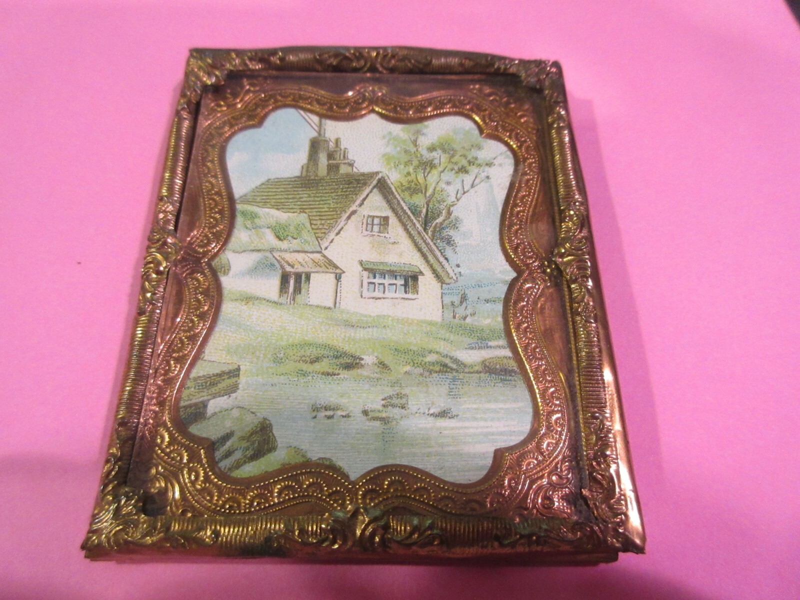 Miniature Art 2″ X 2 1/2″ Appears to be a painting in an old brass holder.